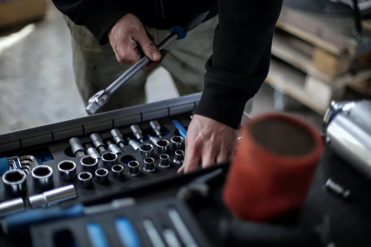 Mechanic choosing a socket from an open tool case