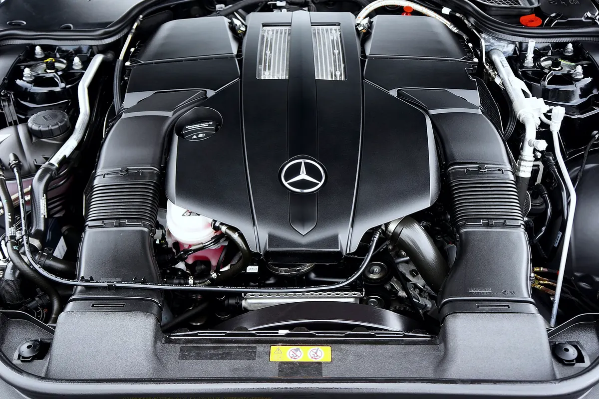 Engine bay of a Mercedes-Benz with the V8 engine cover in view